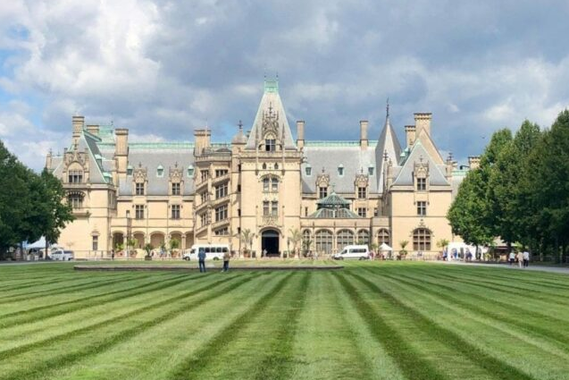 Exterior of Biltmore Estate with green lawn in front